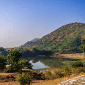 Pariyon ka Talab (Lake of the Fairies) near Khuldabad, with surrounding hills and greenery, once a sacred site of Hindu temples before being rebranded with new legends.