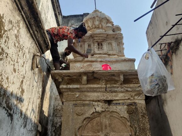 Workers restoring the stone structure of an old Ganesha temple in Bhandara, led by Ramdoot Restores Foundation..