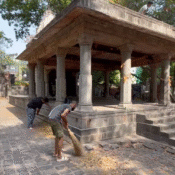 Volunteers from Ramdoot Restores sweeping the surroundings of an ancient temple as part of revival seva.