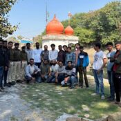 Group of Ramdoot Restores volunteers and local police at Gangour Ghat after temple restoration.