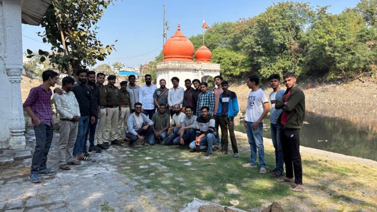 Group of Ramdoot Restores volunteers and local police at Gangour Ghat after temple restoration.